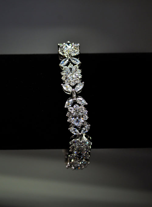 Bold crystal bangle featuring structured row of brilliant stones for polished statement sparkle, product view at Rebecca’s…