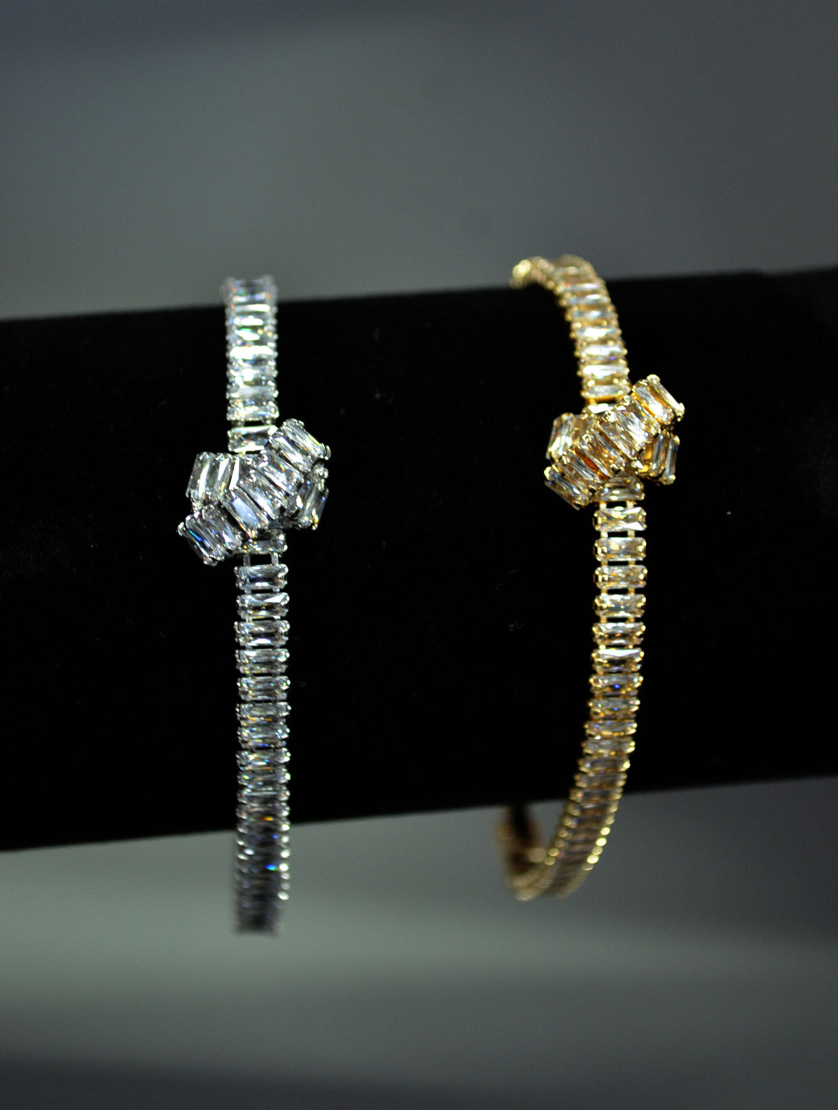 Crystal knot bangle featuring polished geometric knot with a fine double-row band, product view at Rebecca’s Louisville
