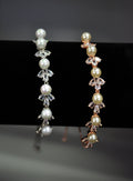 Pearl and crystal adjustable bracelet featuring alternating pearls and bright stones with an easy adjustable finish,…