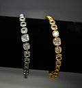 Classic crystal tennis bracelet featuring continuous row of round stones in a clean, timeless setting, product view at…