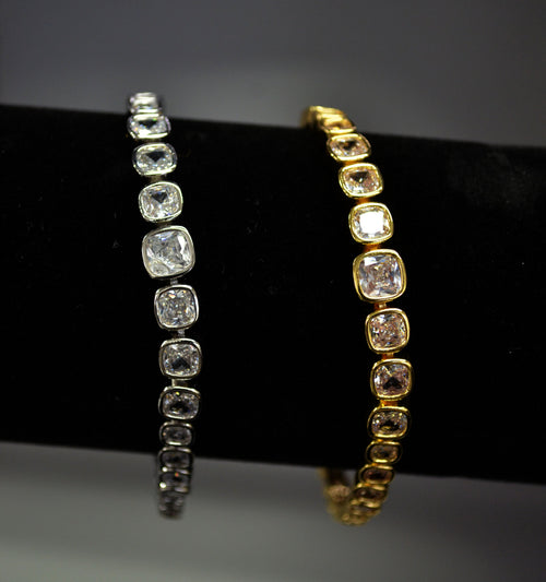 Classic crystal tennis bracelet featuring continuous row of round stones in a clean, timeless setting, product view at…