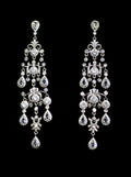 Crystal fringe chandelier earrings featuring multiple sparkling strands with petite teardrop ends, product view at…