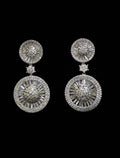 Round sunburst crystal earrings featuring brilliant stud paired with an open circular halo drop, product view at Rebecca’s…