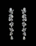 Botanical marquise crystal earrings featuring long branch of leaf-like stones finished with a petite teardrop, product view…