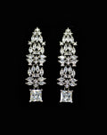 Square and marquise crystal earrings featuring structured cascade ending in a brilliant square-cut stone, product view at…