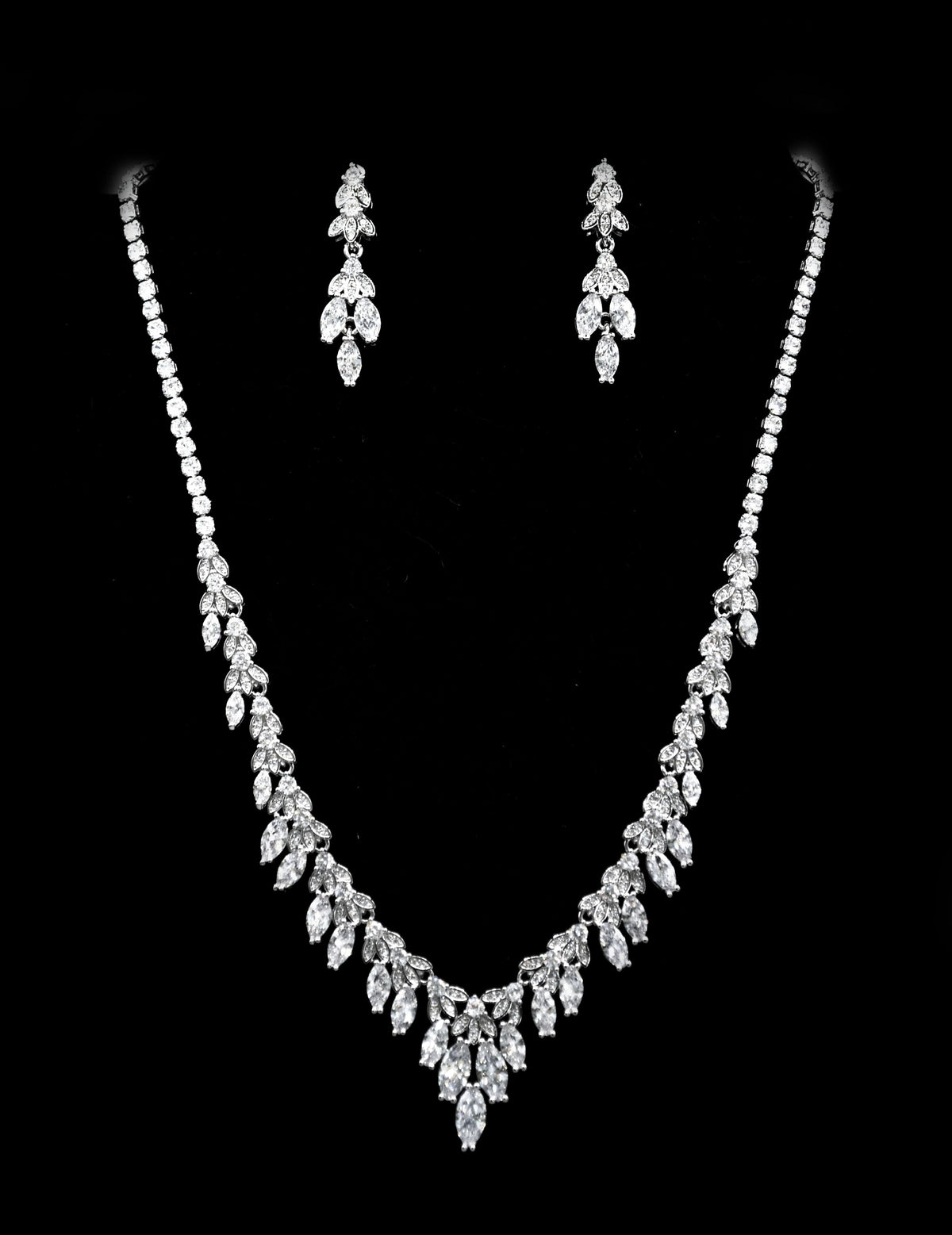 Marquise crystal necklace-and-earring set featuring graceful graduated design with leaf-like stones, product view at…