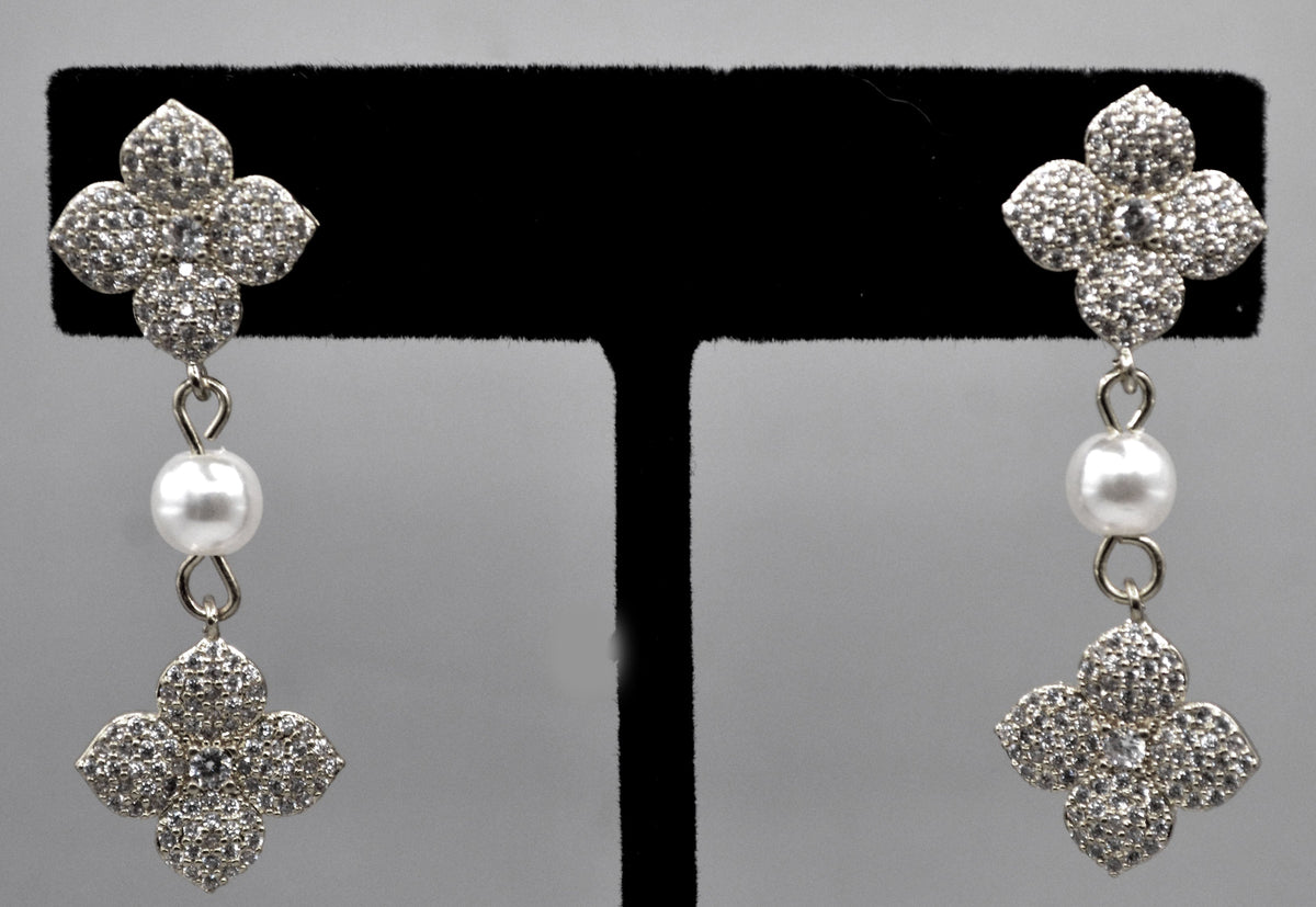 Gold-tone floral pearl earrings featuring sparkling flower motif with a petite pearl drop, alternate view at Rebecca’s…