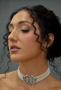 Wide crystal bridal choker featuring close-fitting band with a dimensional center medallion, product view at Rebecca’s…