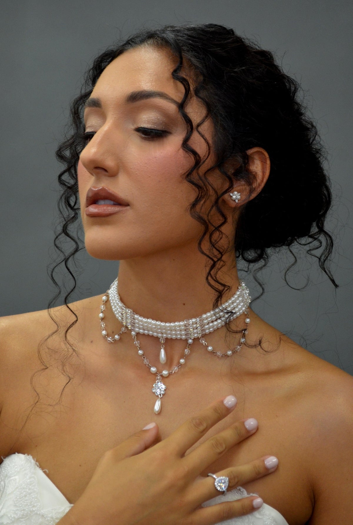 Pearl and crystal choker featuring slim pearl band with graduated crystal-and-pearl drops, detail view at Rebecca’s…