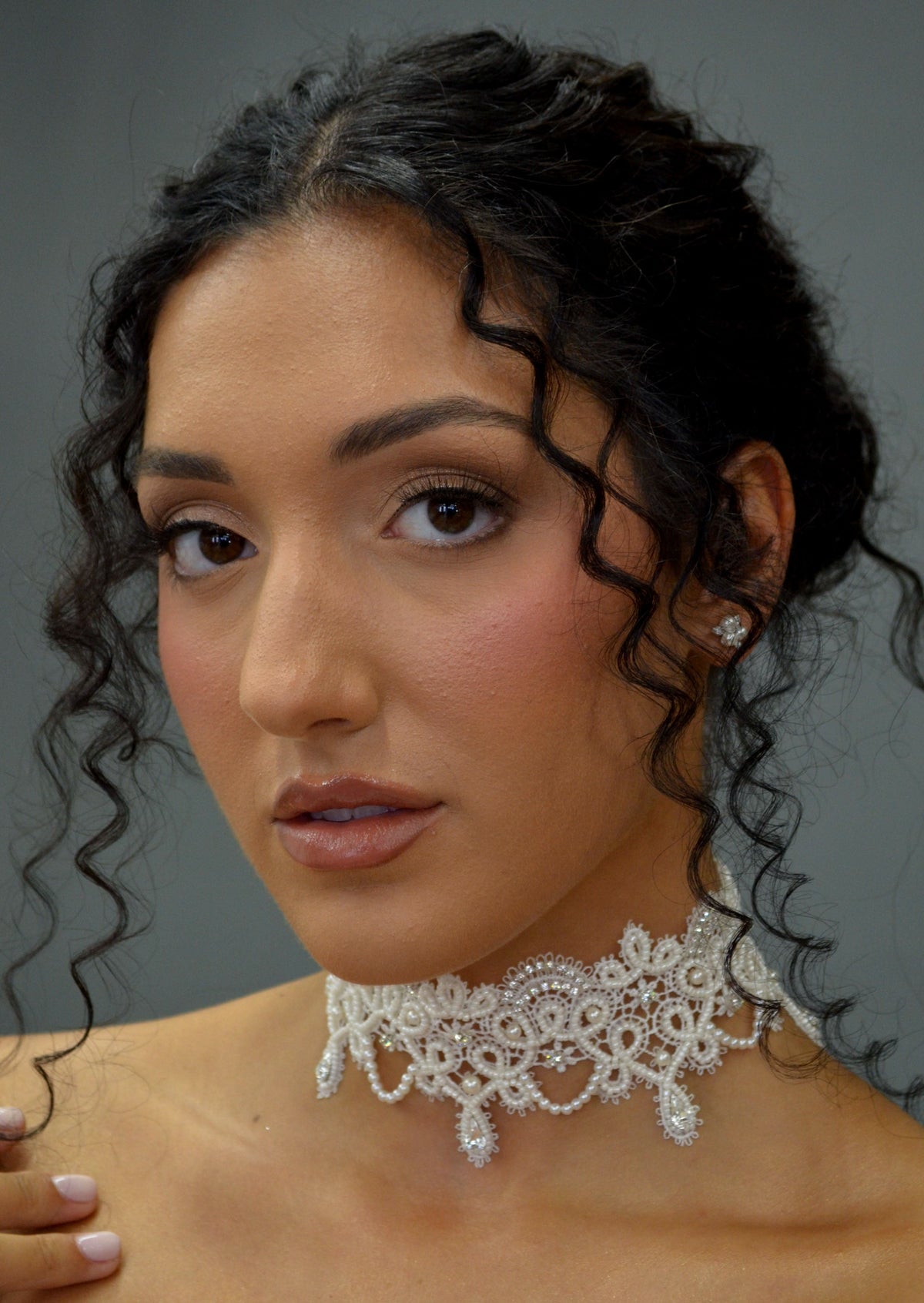 Lace-inspired pearl and crystal choker featuring ornate floral lace motif with pearl details and matching earrings, view 4…