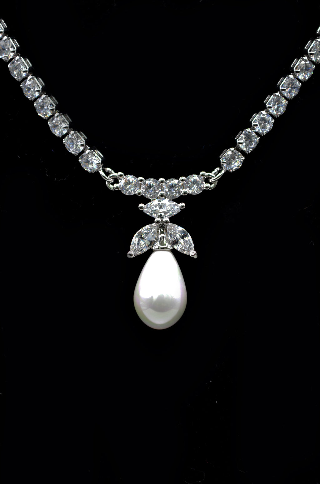 Crystal and pearl necklace-and-earring set featuring graduated crystal strand finished with matching pearl drops, alternate…