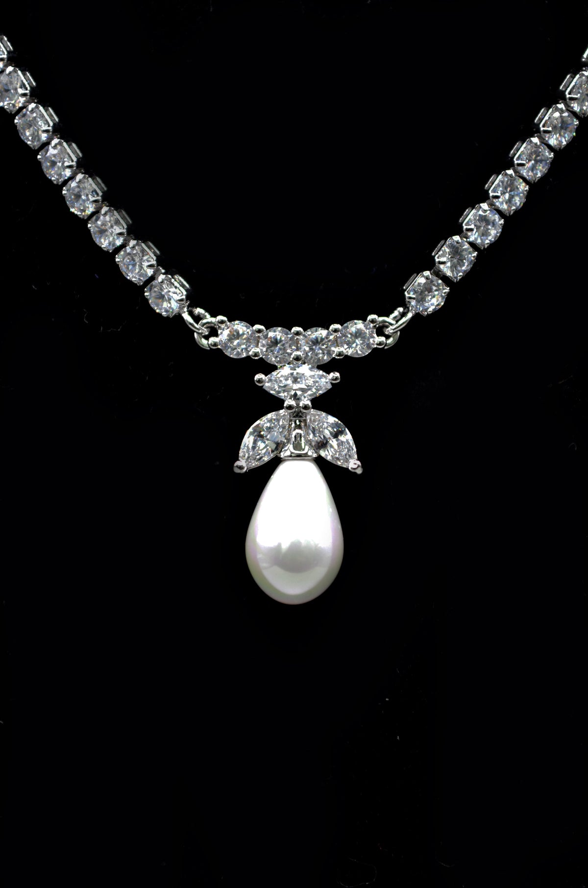 Crystal and pearl necklace-and-earring set featuring graduated crystal strand finished with matching pearl drops, alternate…