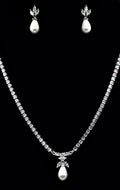 Crystal and pearl necklace-and-earring set featuring graduated crystal strand finished with matching pearl drops, product…