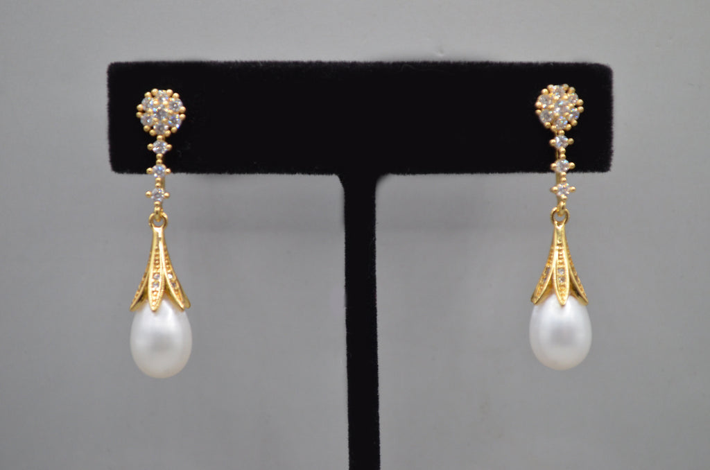 Pear-cut crystal drop earrings featuring faceted teardrop stone beneath a petite geometric crystal top, alternate view at…