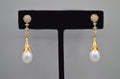 Pear-cut crystal drop earrings featuring faceted teardrop stone beneath a petite geometric crystal top, alternate view at…