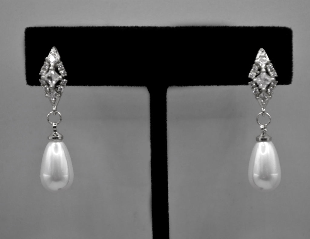 Pearl teardrop earrings featuring luminous pear-shaped pearl suspended from a petite crystal setting, alternate view at…