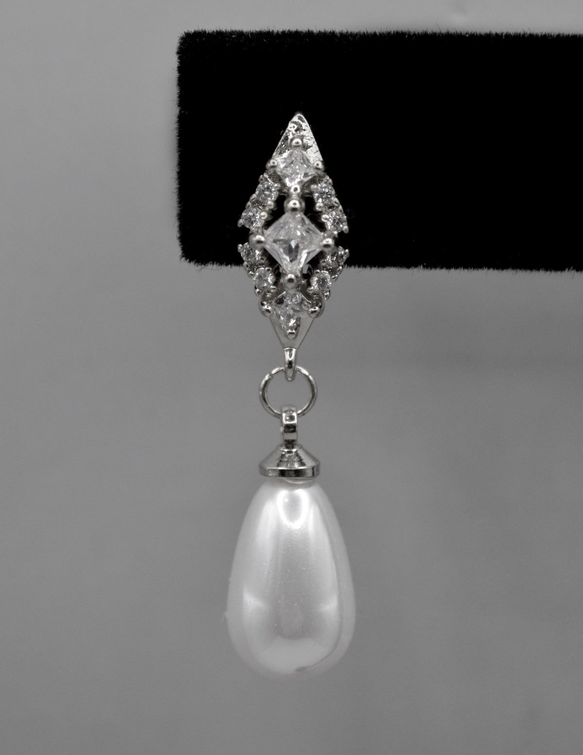 Pearl teardrop earrings featuring luminous pear-shaped pearl suspended from a petite crystal setting, view 4 at Rebecca’s…