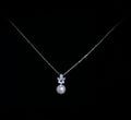Silver-tone pearl drop pendant featuring petite crystal accent and luminous pearl drop, product view at Rebecca’s Louisville