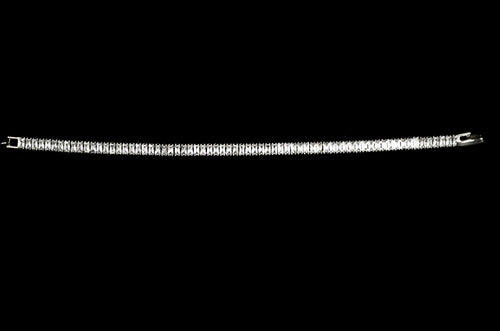 Baguette crystal tennis bracelet featuring continuous line of rectangular stones in a sleek setting, alternate view at…