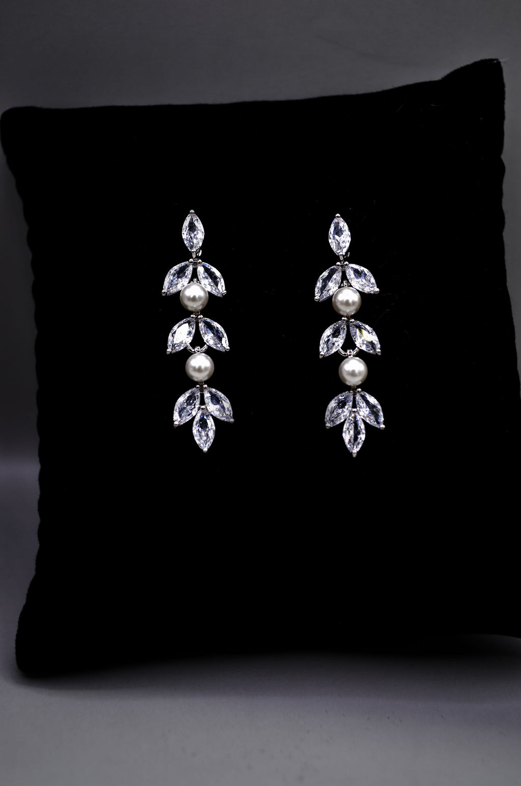 Petite crystal leaf earrings featuring compact botanical cluster with a subtle drop silhouette, product view at Rebecca’s…