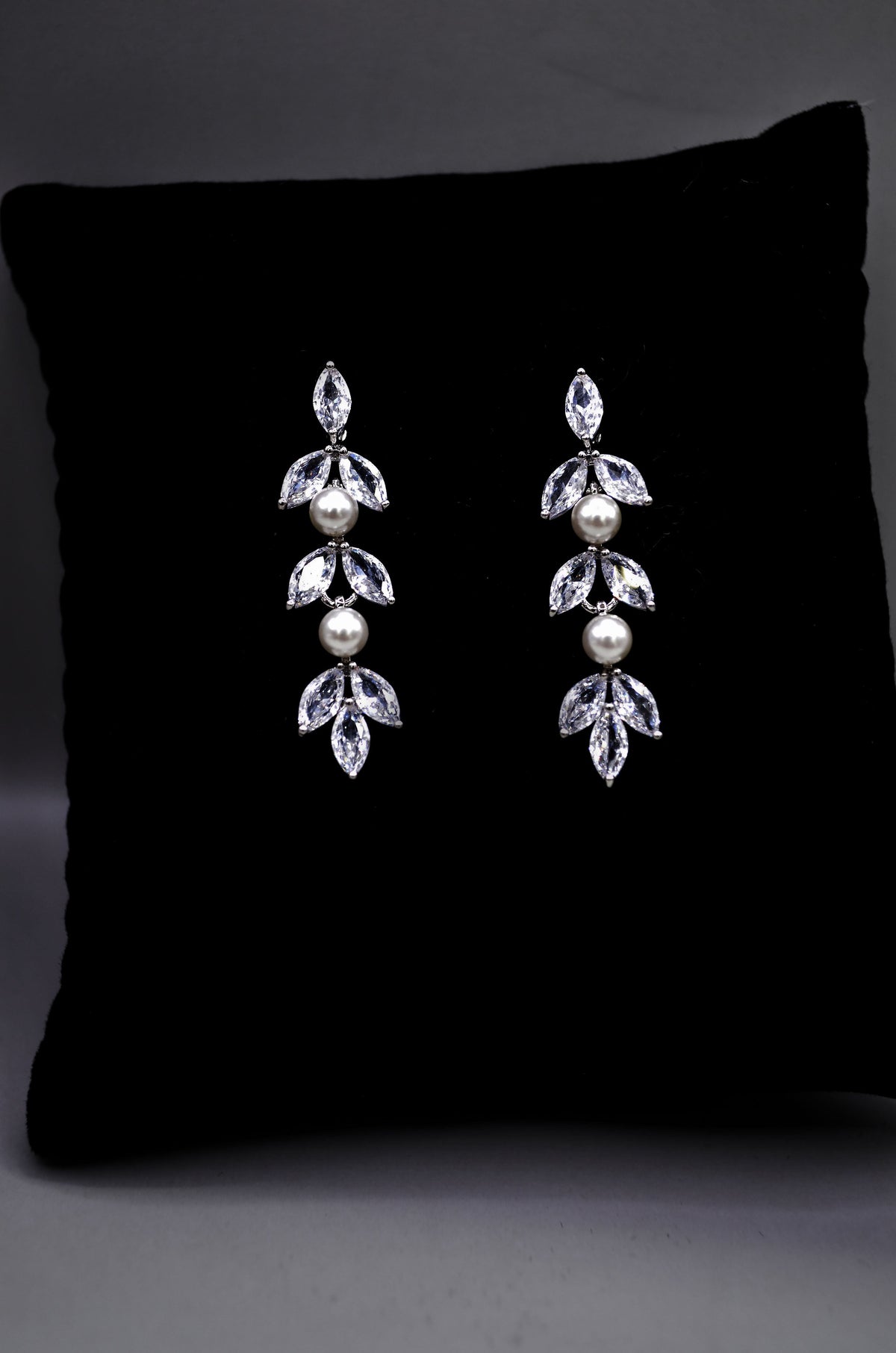 Petite crystal leaf earrings featuring compact botanical cluster with a subtle drop silhouette, product view at Rebecca’s…