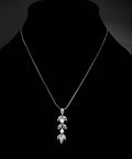Silver-tone crystal vine pendant featuring delicate pendant with marquise-cut crystal leaves and a teardrop center, product…