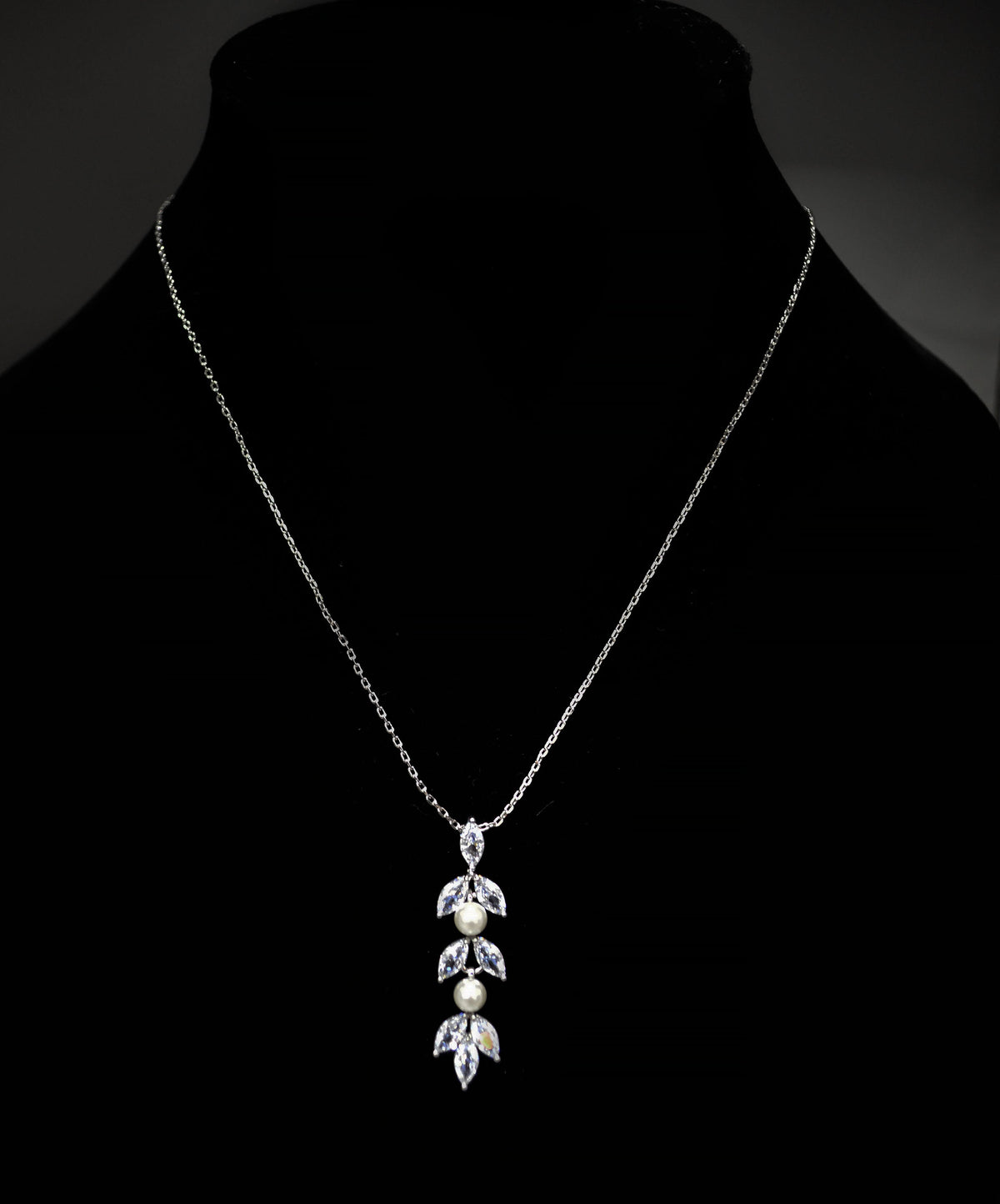 Silver-tone crystal vine pendant featuring delicate pendant with marquise-cut crystal leaves and a teardrop center, product…