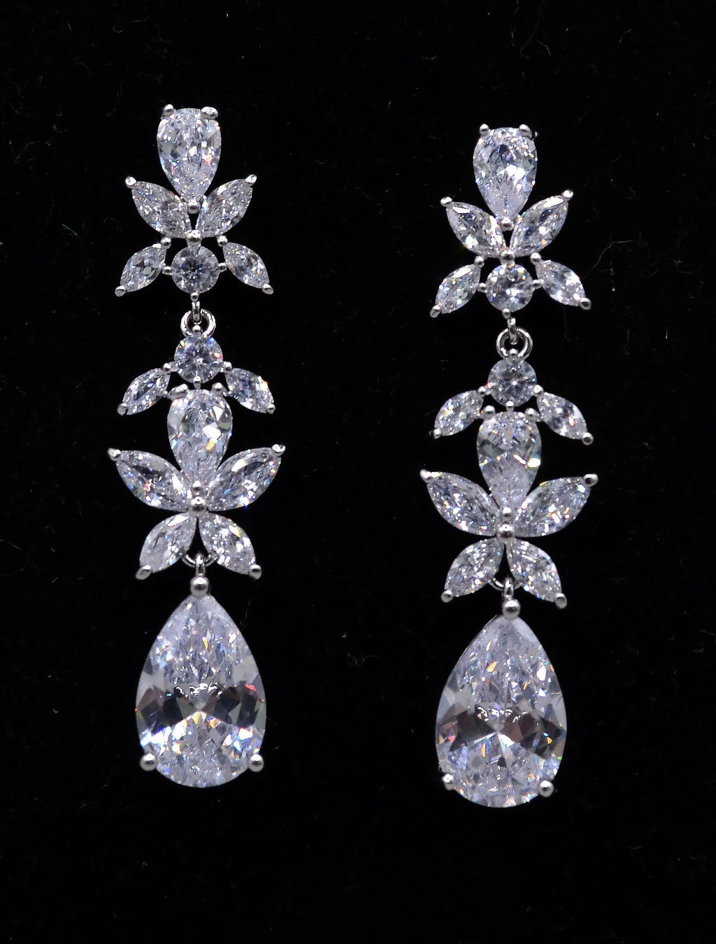 Floral crystal teardrop earrings featuring sparkling flower cluster above a brilliant pear-shaped drop, alternate view at…
