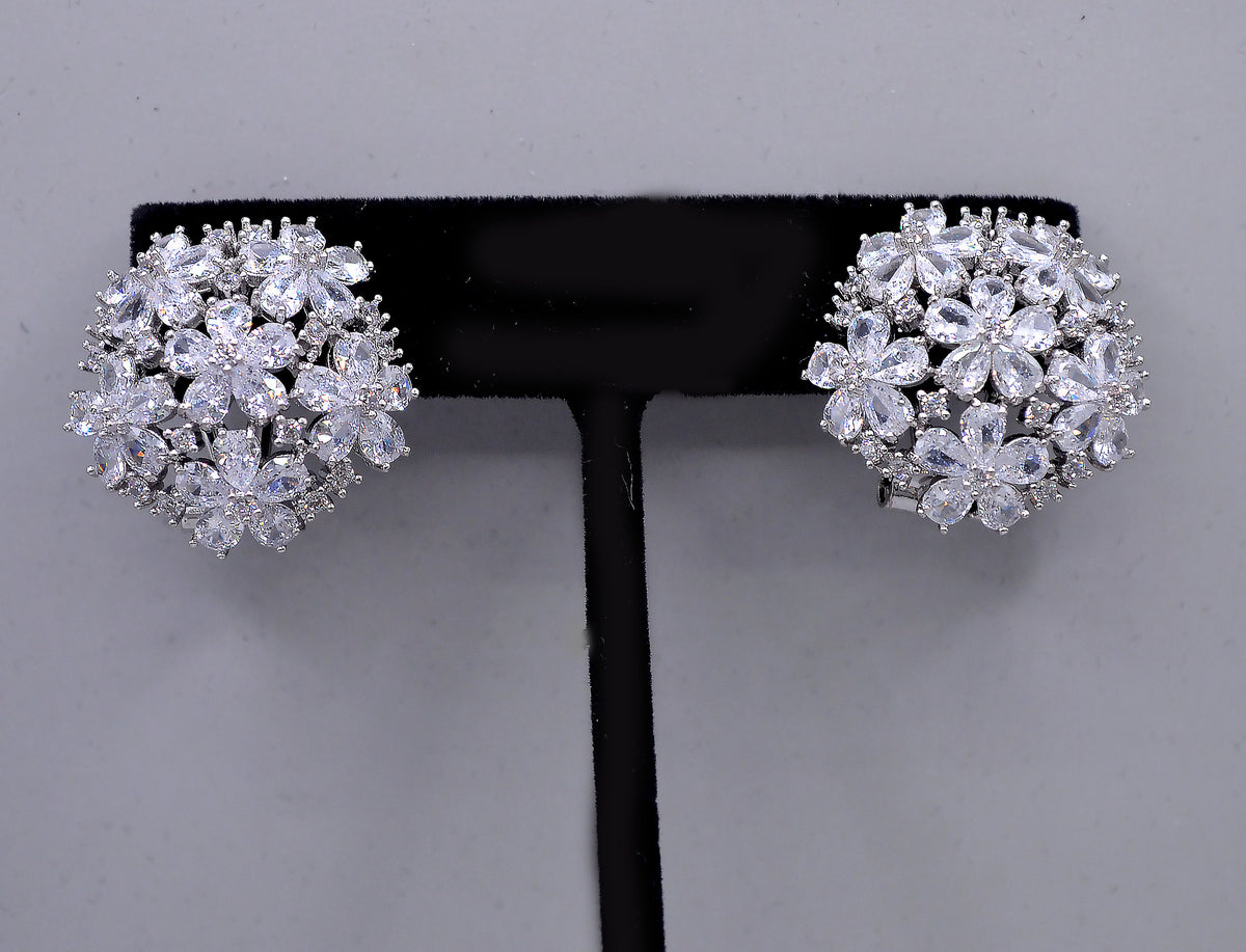 Crystal flower cluster studs featuring full dimensional bloom made from marquise-cut stones, detail view at Rebecca’s…