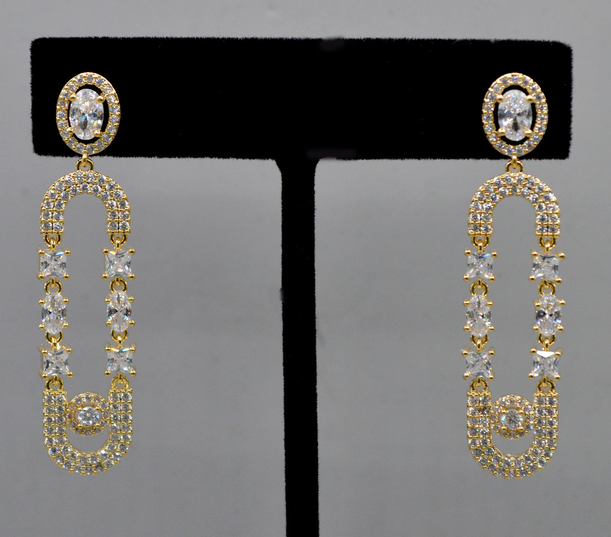 Double-loop crystal earrings featuring elongated linked loops covered in petite sparkling stones, alternate view at…