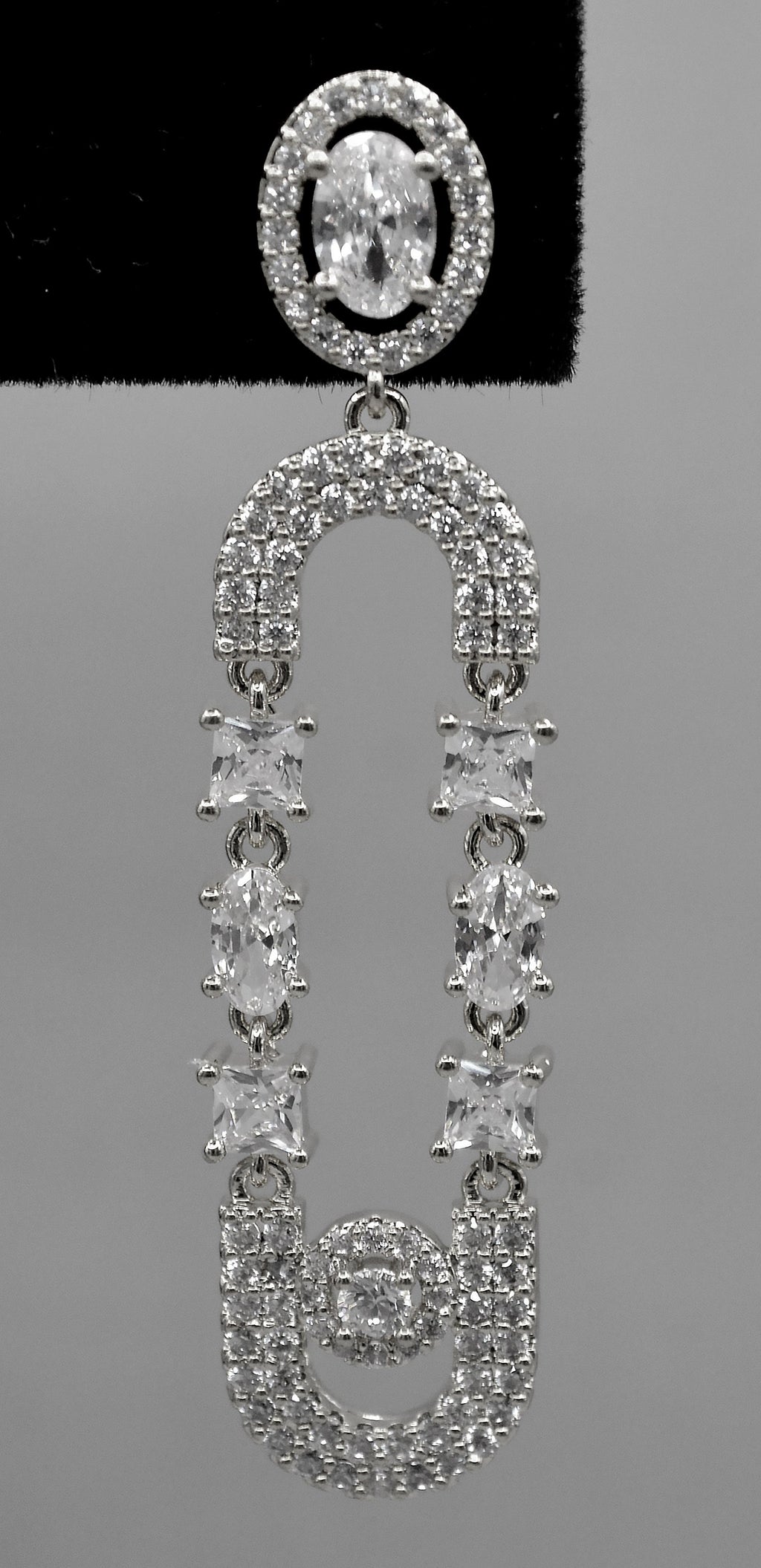 Double-loop crystal earrings featuring elongated linked loops covered in petite sparkling stones, view 4 at Rebecca’s…