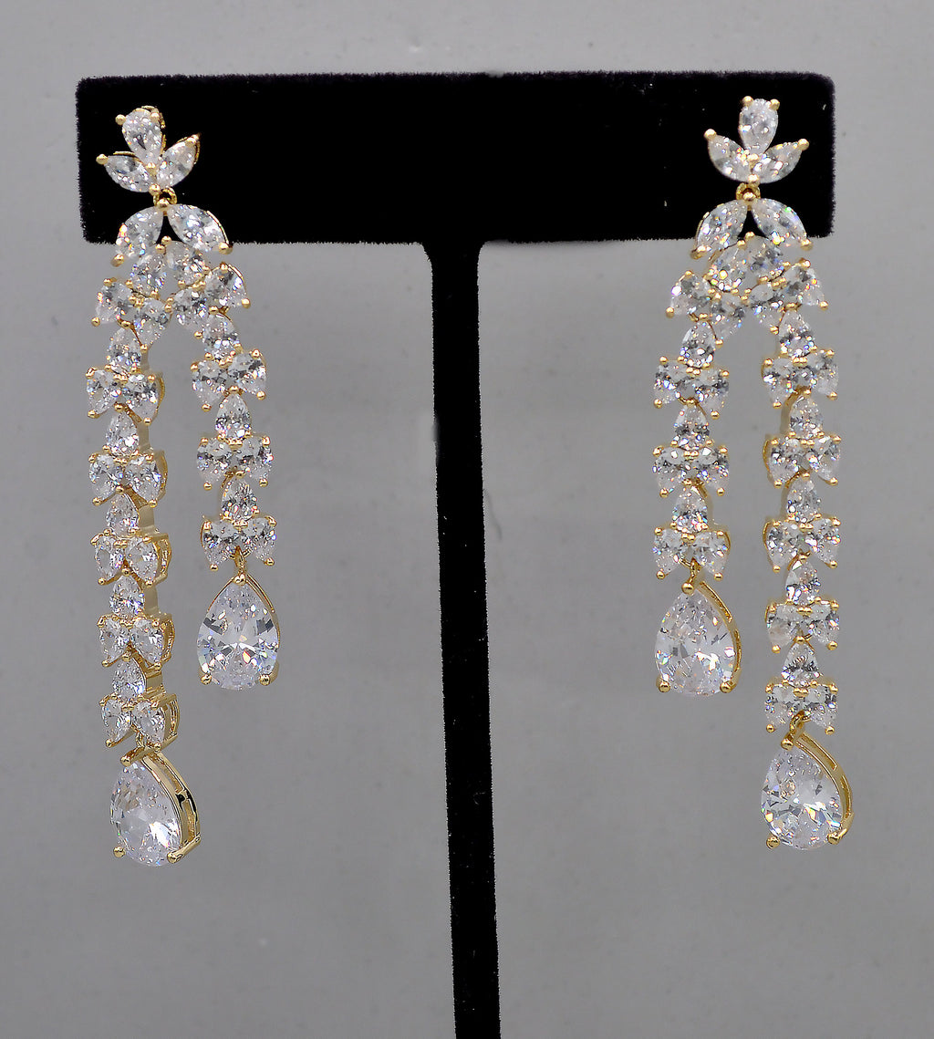 Double-drop crystal earrings featuring airy geometric chain of square and round stones, product view at Rebecca’s Louisville