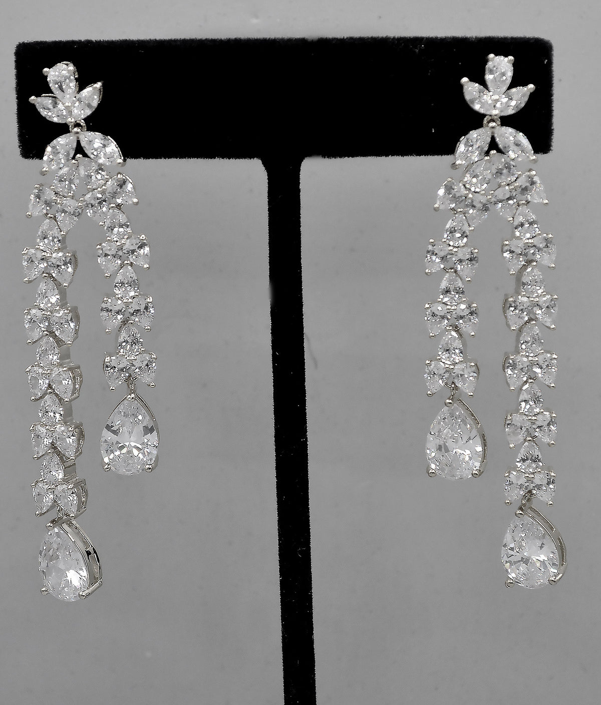Double-drop crystal earrings featuring airy geometric chain of square and round stones, alternate view at Rebecca’s…