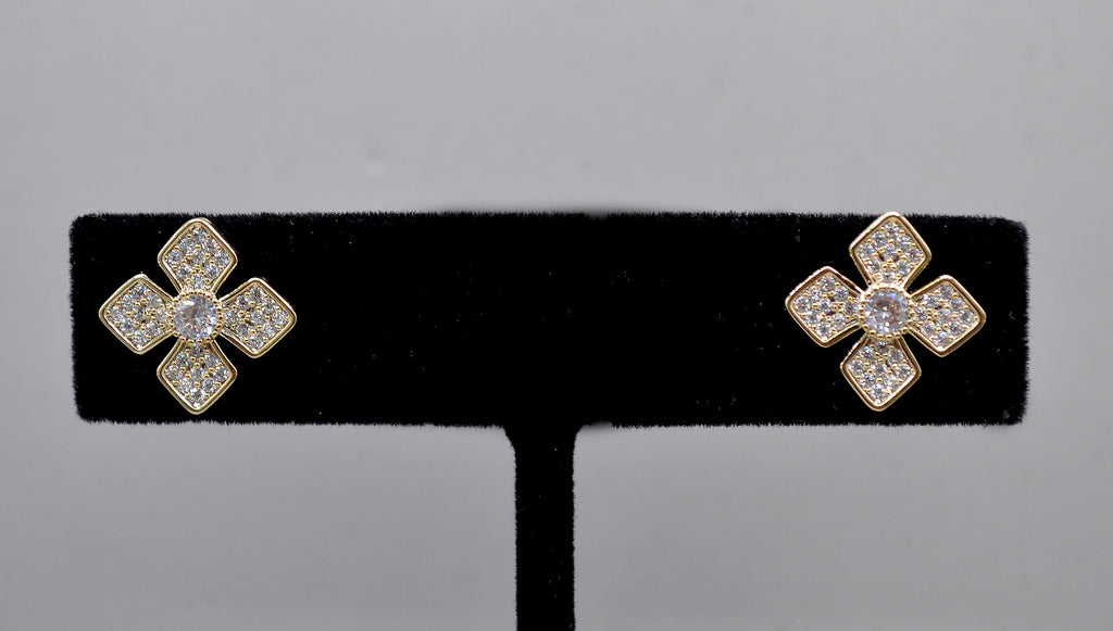 Geometric crystal clover studs featuring four square-cut stones arranged in a modern floral cross, alternate view at…