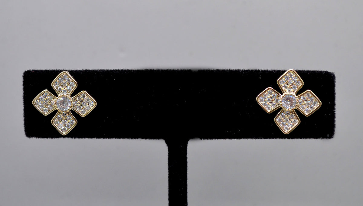 Geometric crystal clover studs featuring four square-cut stones arranged in a modern floral cross, alternate view at…
