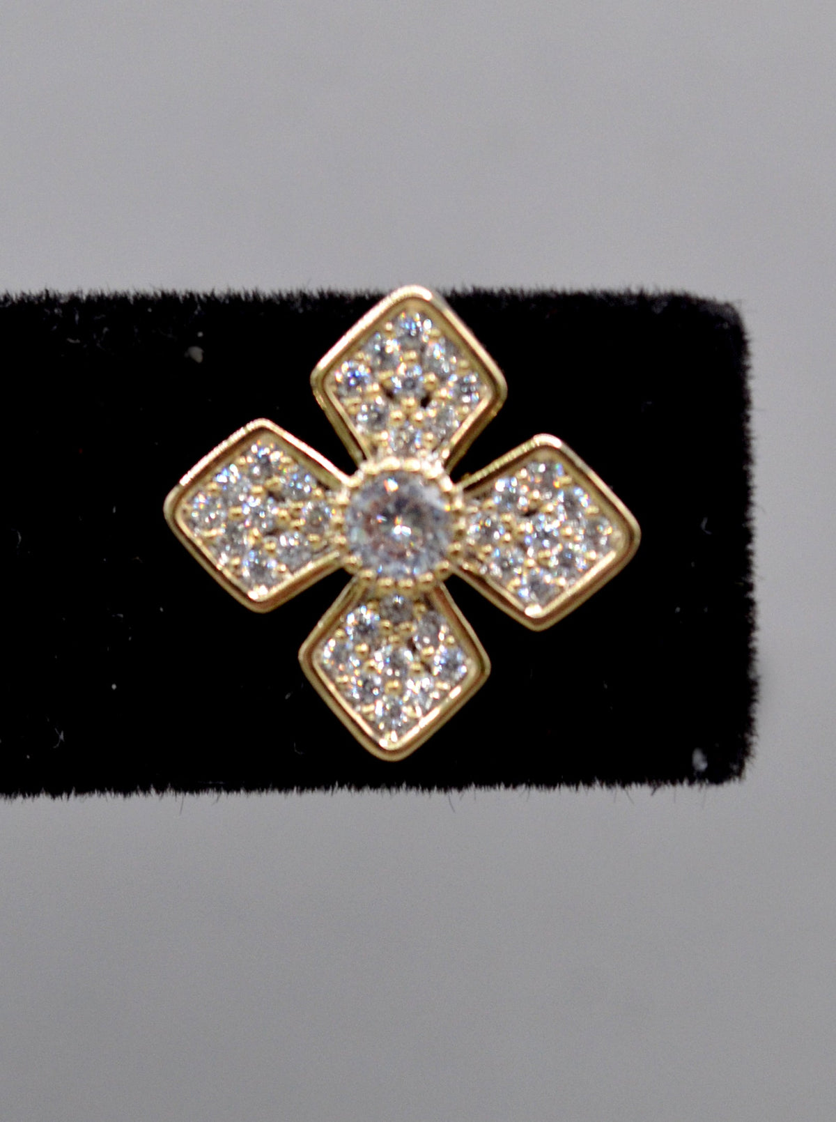 Geometric crystal clover studs featuring four square-cut stones arranged in a modern floral cross, view 5 at Rebecca’s…